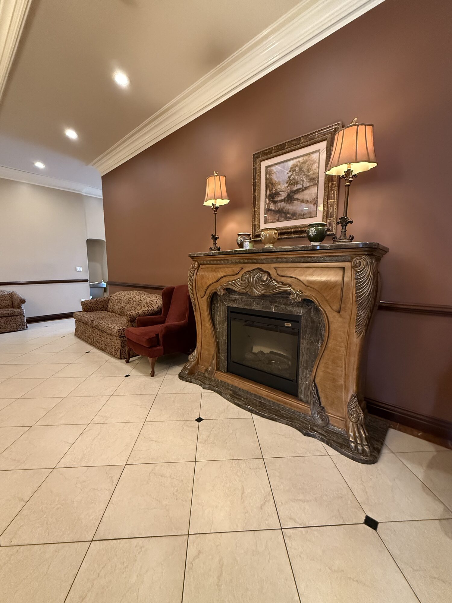 A warm sitting area with comfortable seating and fireplace details.