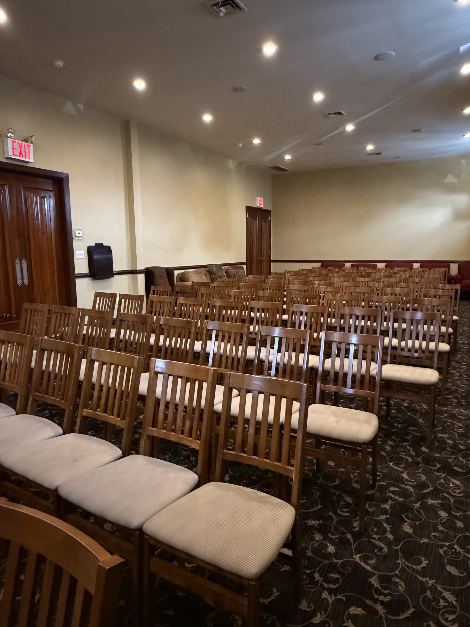 Chapel seating configured for a memorial gathering.